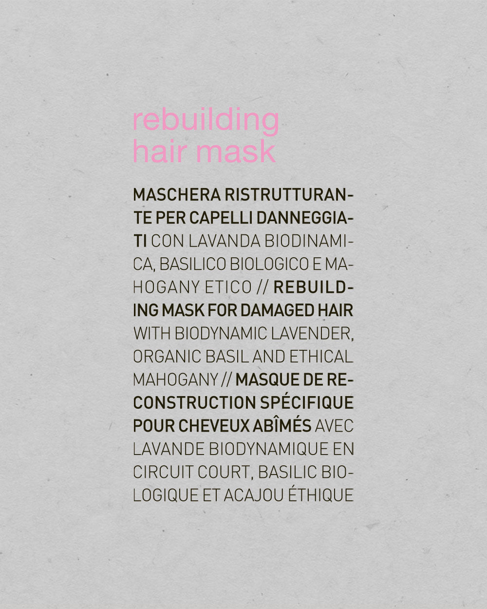 Product label for 'rebuilding hair mask' with text on a gray background
